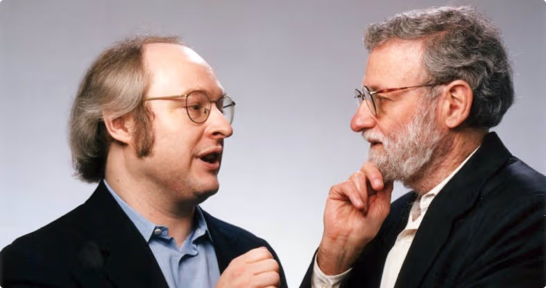 Jakob Nielsen y Donald Norman conversando, figuras clave en el desarrollo del diseño centrado en el usuario y fundadores del Nielsen Norman Group
